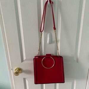Red and gold bag with a gold chain - perfect for a night out!